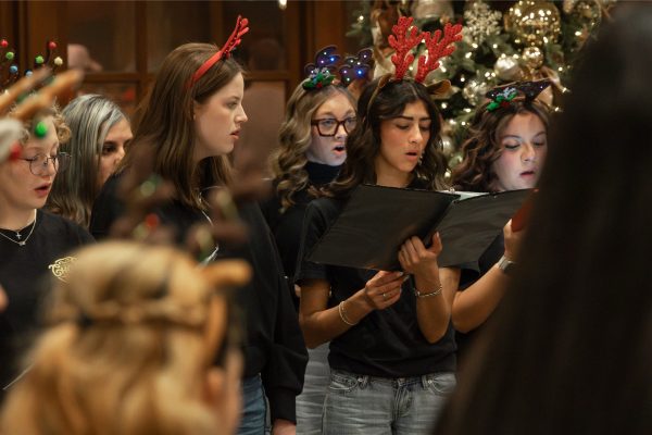Lubbock High School choir singing Christmas carols while wearing Christmas headbands.