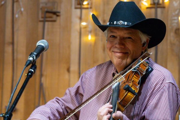 Man playing violin at Candlelight at the Ranch.