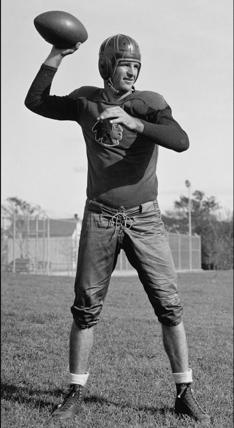 Slingin' Sammy Baugh throwing a football as quarterback for the Redskins.
